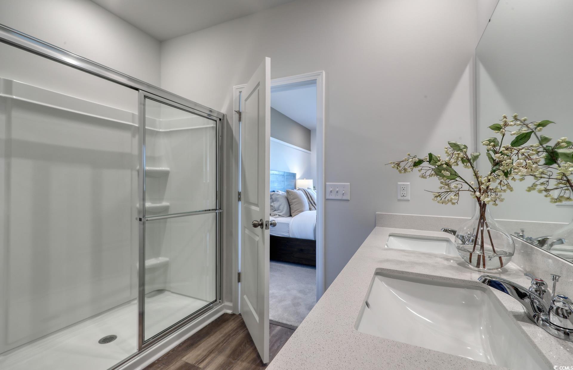 978 Laconic Drive Myrtle Beach, SC 29588 - Photo 16 of 19 Bathroom featuring vanity, an enclosed shower, and