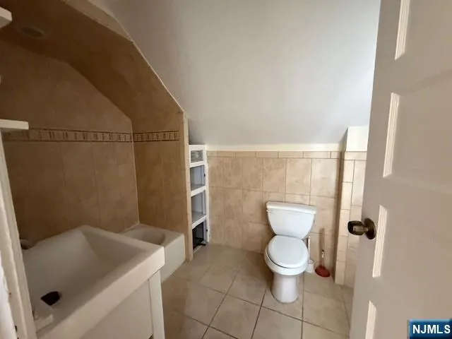 a bathroom with a toilet and a sink
