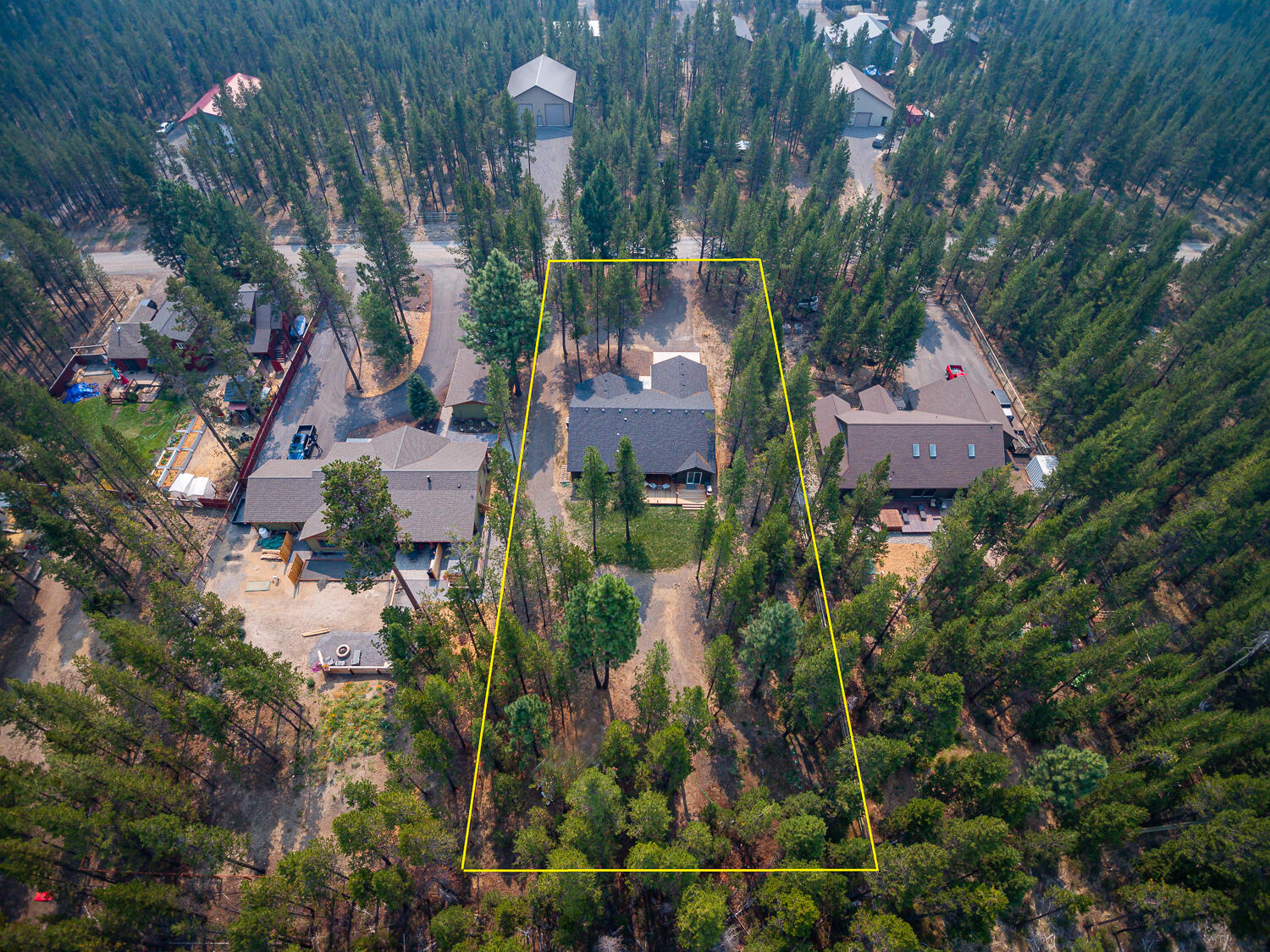 17160 Elsinore Road Bend, OR 97707 - Photo 40 of 47 an aerial view of a house with a yard and garden