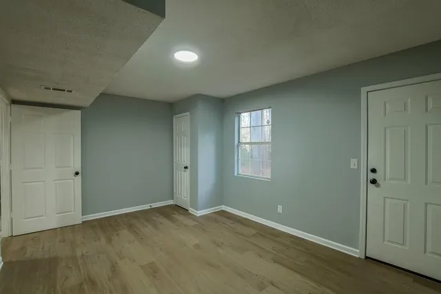 a view of an empty room and window