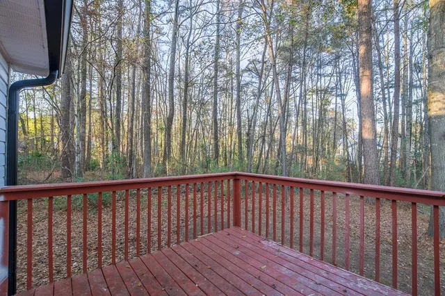 a wooden bench sitting in front of a building