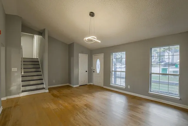wooden floor and windows in an empty room