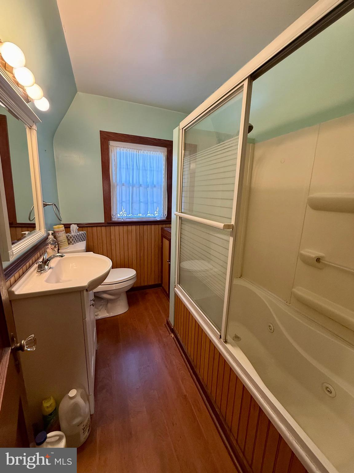 13925 Ellerslie Road Ellerslie, MD 21529 - Photo 12 of 12 a bathroom with a sink and mirror with bathtub