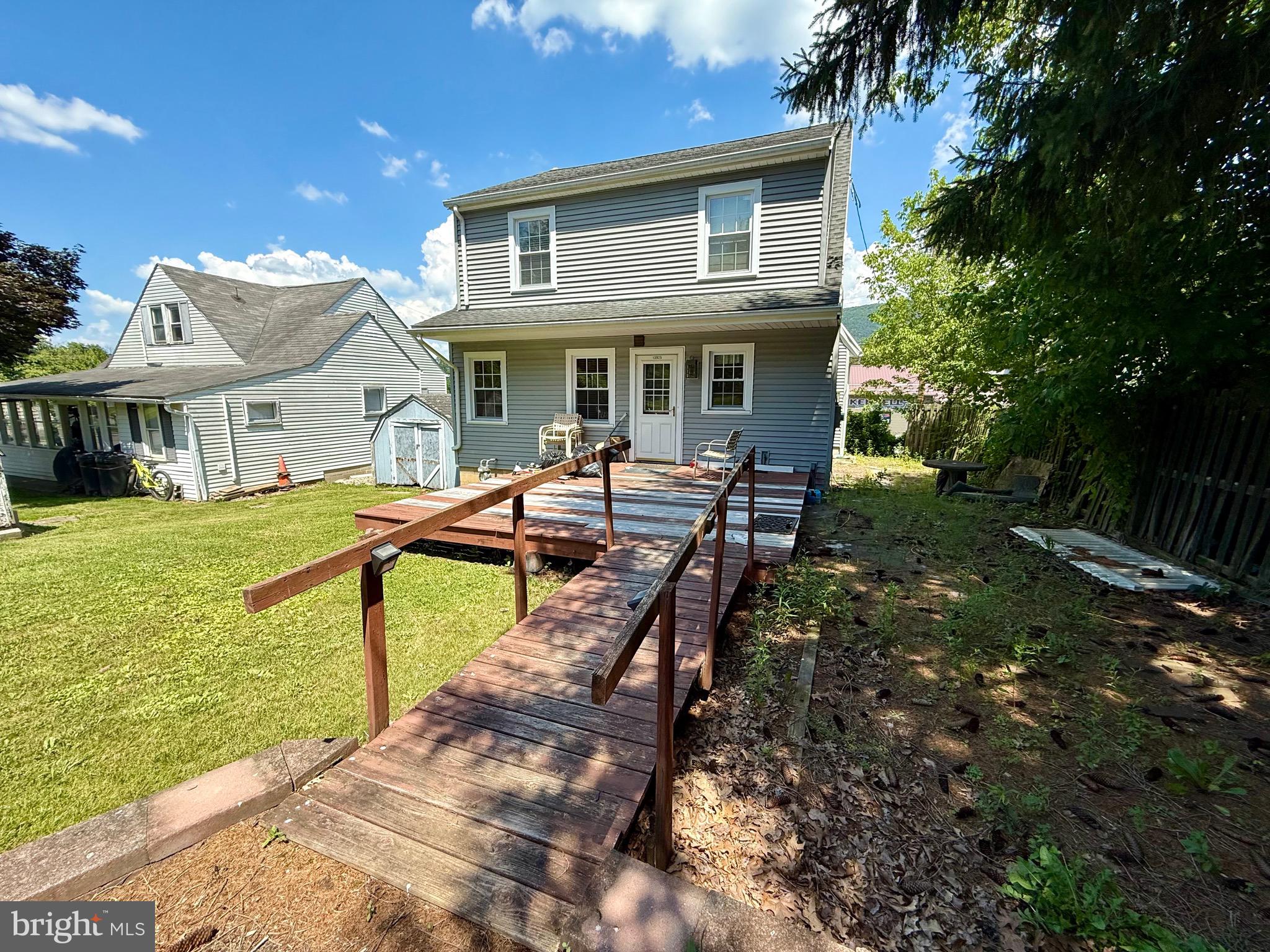 13925 Ellerslie Road Ellerslie, MD 21529 - Photo 2 of 12 a view of an house with backyard porch and outdoor kitchen