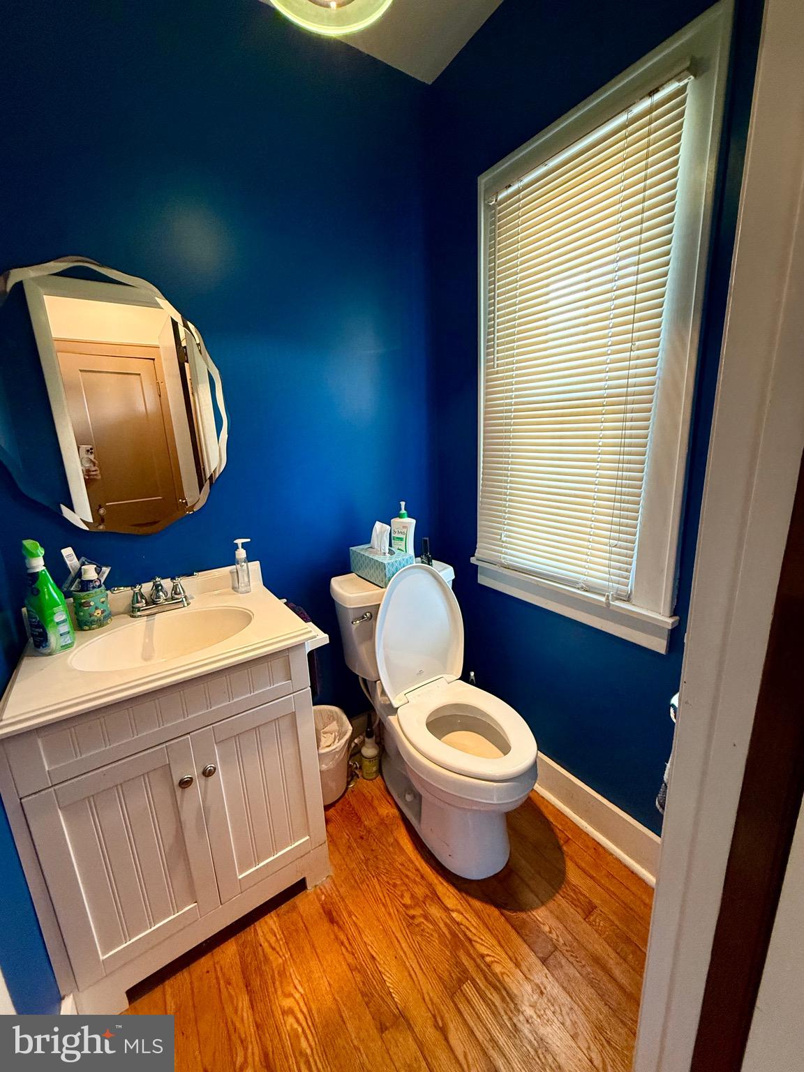 13925 Ellerslie Road Ellerslie, MD 21529 - Photo 7 of 12 a bathroom with a sink mirror vanity and toilet