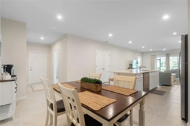 a kitchen with a table and chairs in it