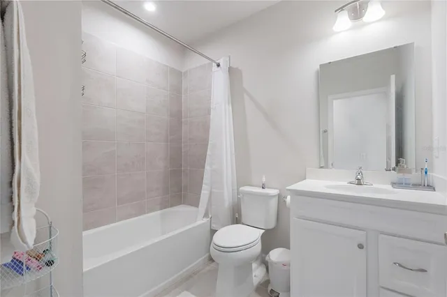 a bathroom with a sink a toilet and a bathtub