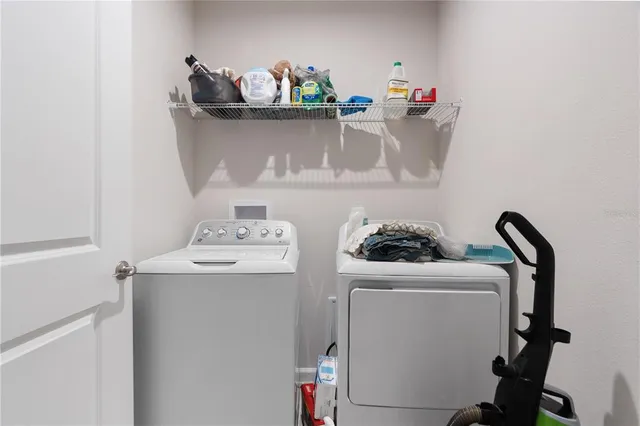 a utility room with dryer and washer