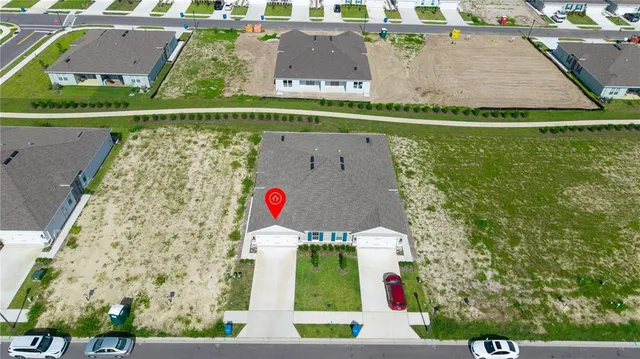 a view of a house with pool and a yard
