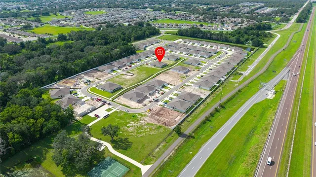 a view of swimming pool with a white house