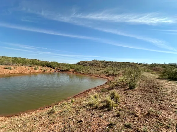 a view of a road with an ocean view