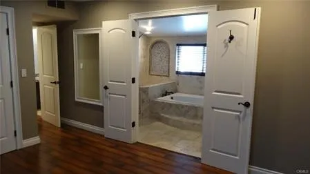 a bathroom with a mirror and a shower