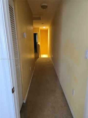 a view of hallway with stairs