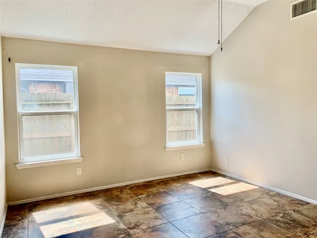 a bathroom with a tub shower and sink