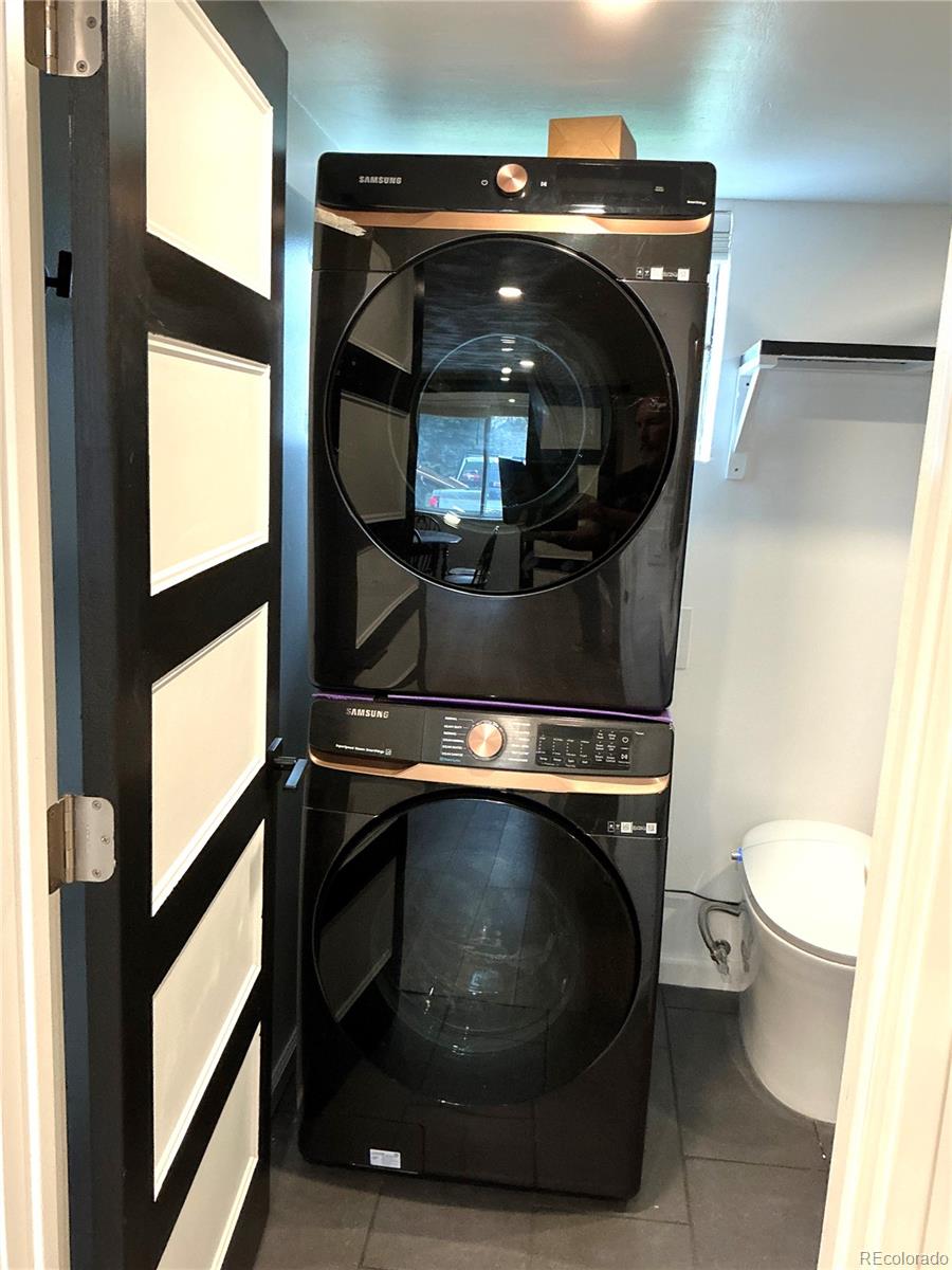 Undisclosed Address Aurora, CO 80010 - Photo 12 of 23 a bathroom with a toilet and a mirror