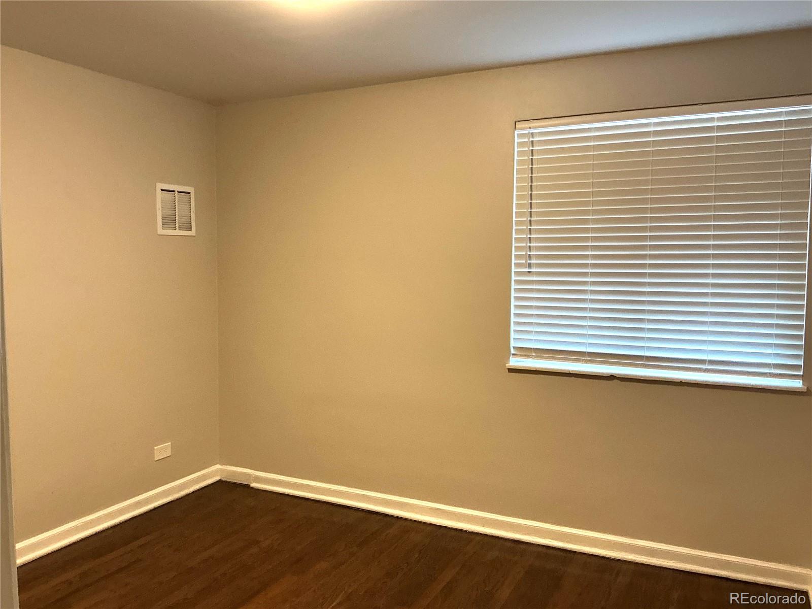 Undisclosed Address Aurora, CO 80010 - Photo 17 of 23 a view of a small space with wooden floor and a window