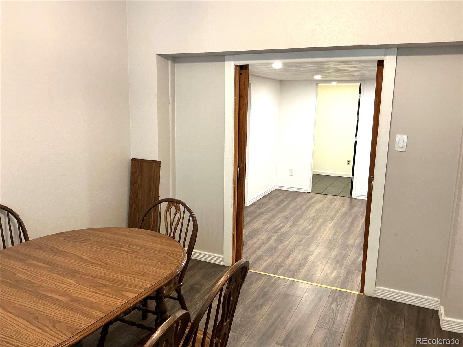 Undisclosed Address Aurora, CO 80010 - Photo 7 of 23 a view of a room with wooden floor