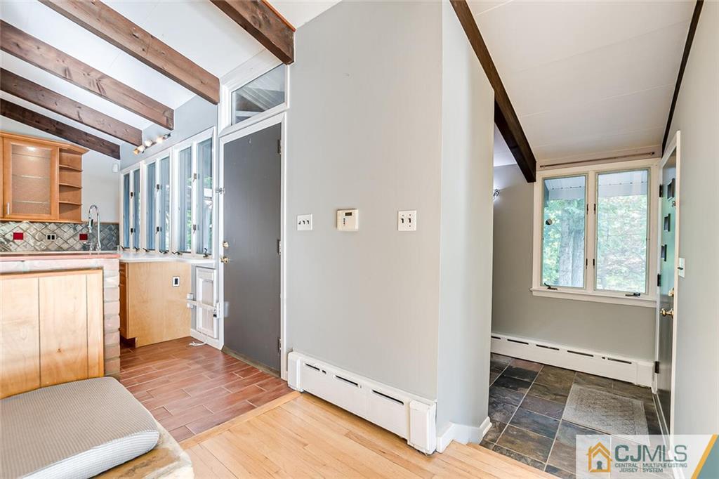 33 Davidson's Mill Road North Brunswick, NJ 08902 - Photo 41 of 58 a view of a hallway with wooden floor and windows