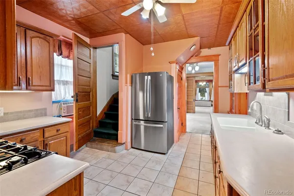 a spacious bathroom with a granite countertop sink a mirror and a shower