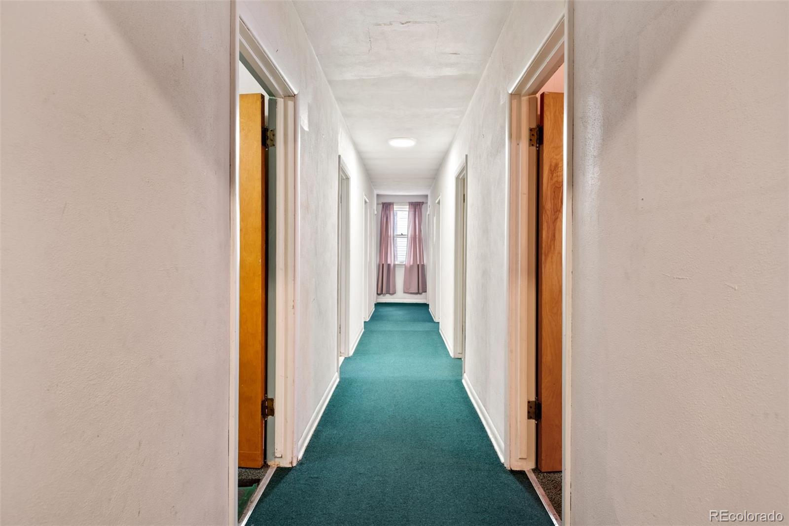 303 South 3rd Street Sterling, CO 80751 - Photo 19 of 50 a view of a hallway with a yellow space