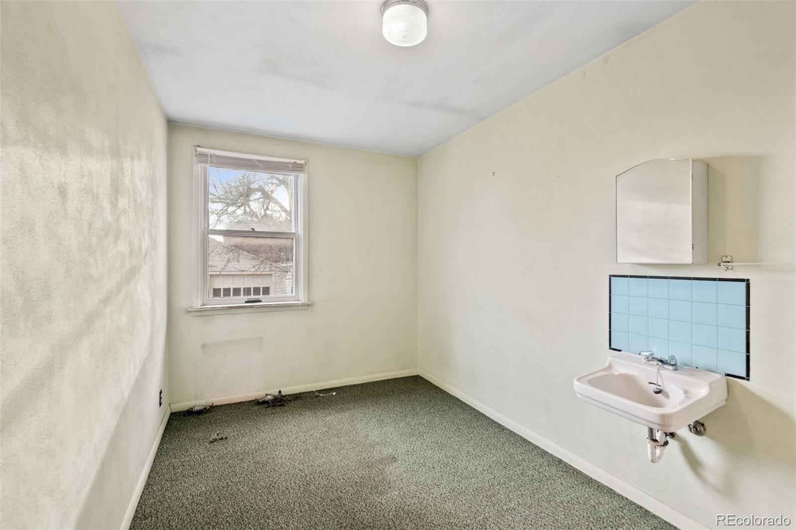 303 South 3rd Street Sterling, CO 80751 - Photo 24 of 50 an empty room with a window