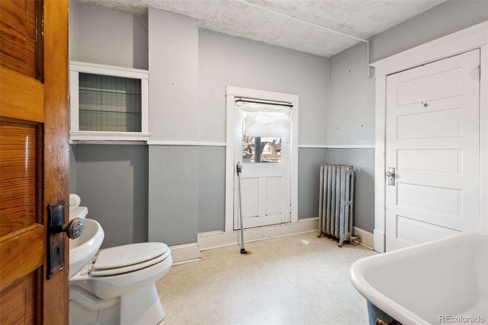 303 South 3rd Street Sterling, CO 80751 - Photo 36 of 50 a bathroom with a toilet and a sink