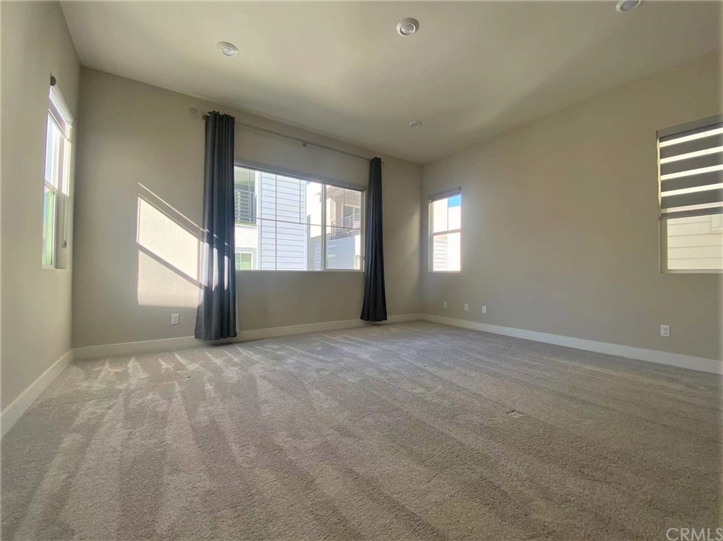 114 Spiral Irvine, CA 92618 - Photo 2 of 15 an empty room with windows