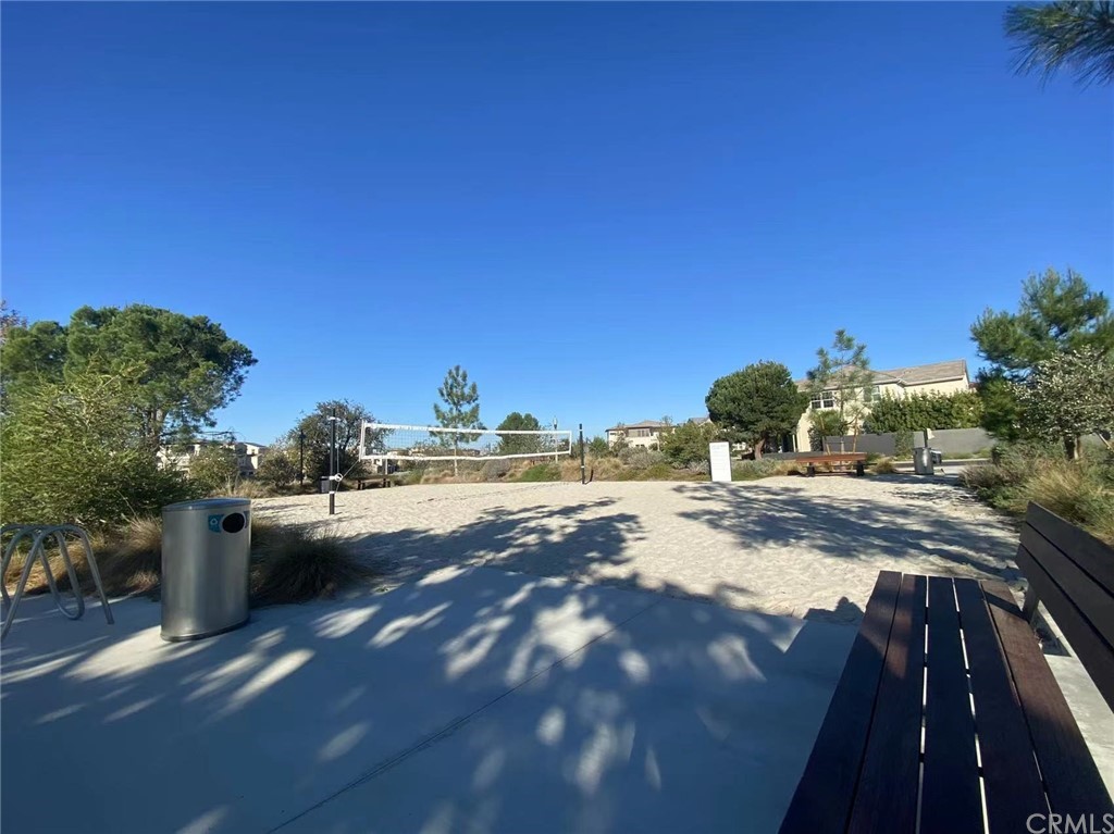 114 Spiral Irvine, CA 92618 - Photo 15 of 15 a view of a swimming pool with a yard and furniture