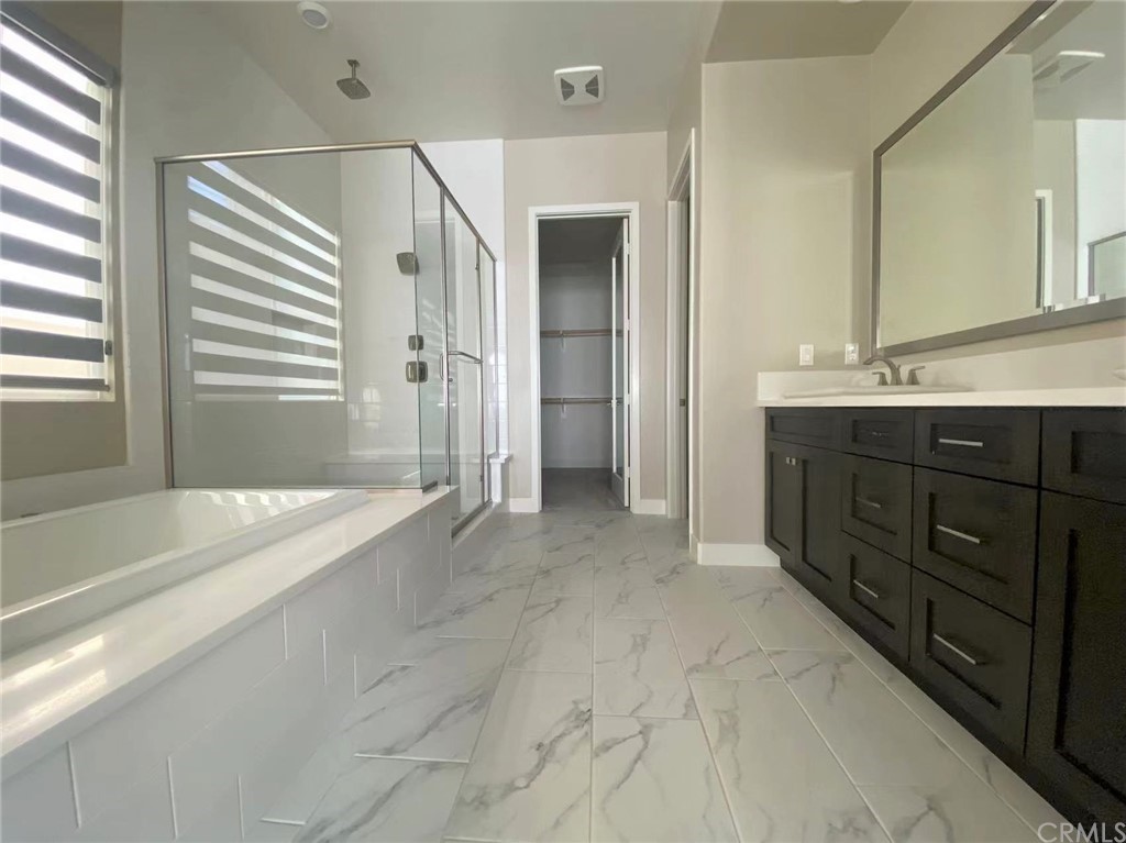 114 Spiral Irvine, CA 92618 - Photo 3 of 15 a spacious bathroom with a tub sink and mirror