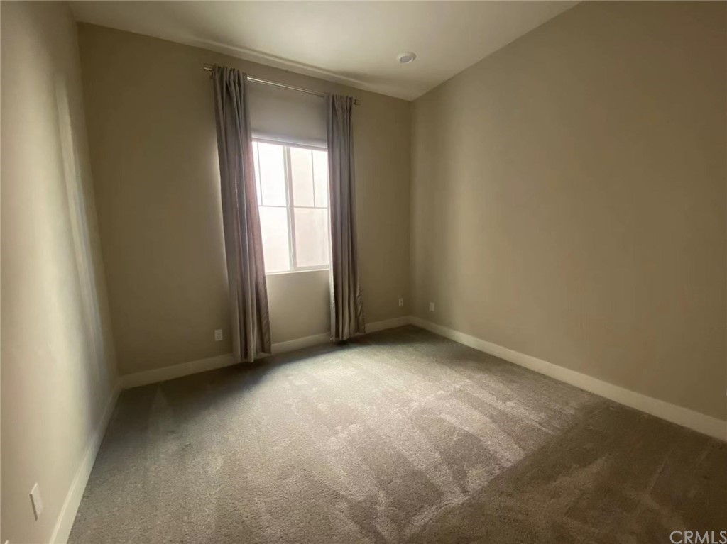 114 Spiral Irvine, CA 92618 - Photo 4 of 15 an empty room with window