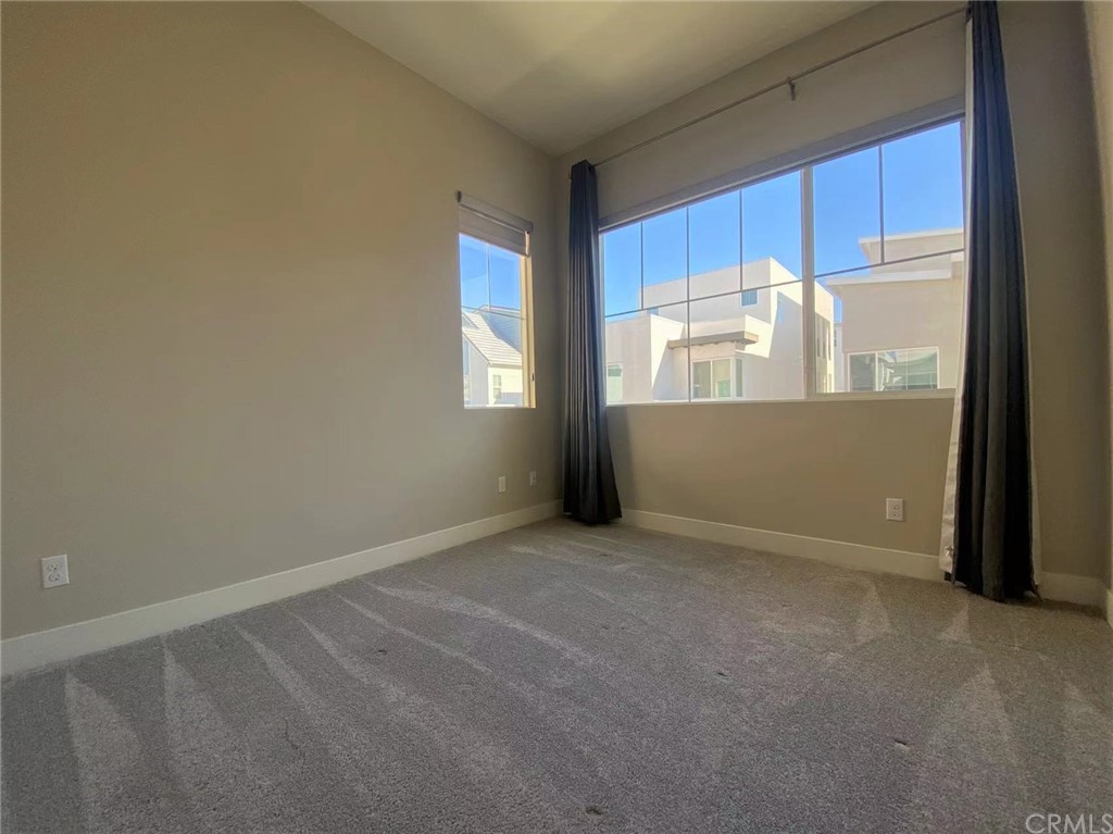 114 Spiral Irvine, CA 92618 - Photo 6 of 15 an empty room with windows