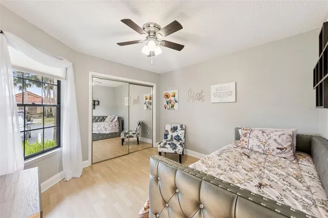 a bedroom with a bed and window