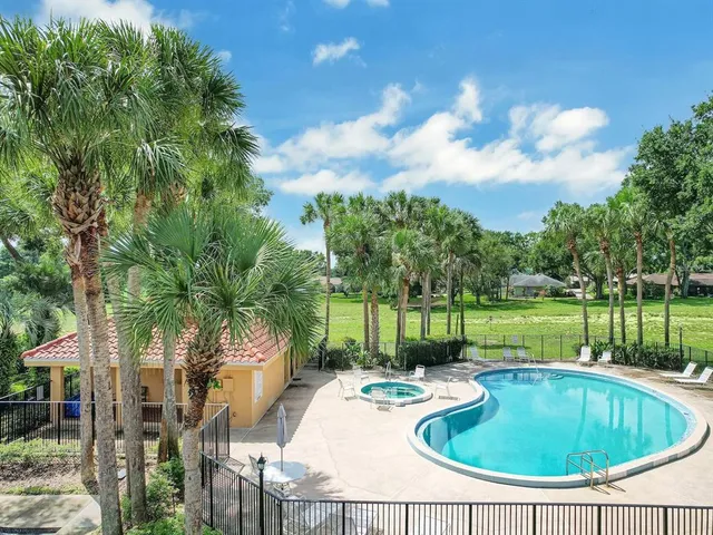 a view of a swimming pool with a patio