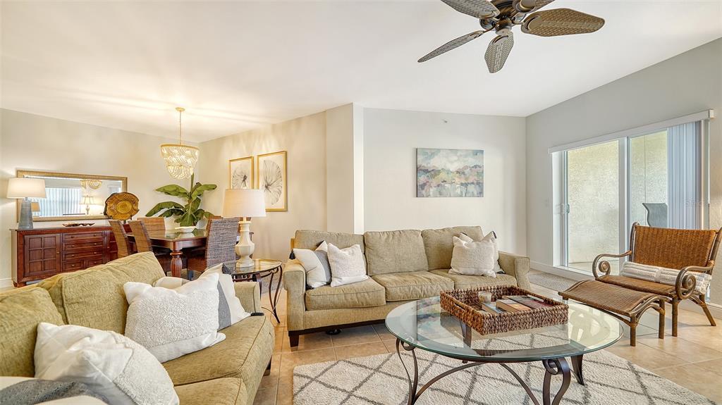 14041 Bellagio Way, Unit 316 Osprey, FL 34229 - Photo 11 of 74 a living room with furniture and a wooden floor