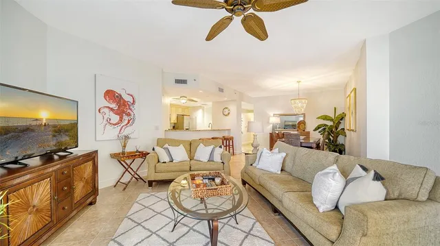a view of a dining room with furniture and a chandelier