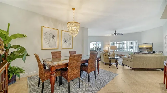 a kitchen with stainless steel appliances granite countertop a refrigerator a stove a sink and dishwasher