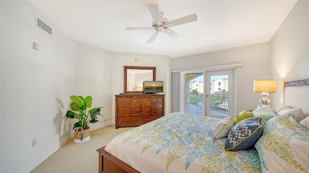14041 Bellagio Way, Unit 316 Osprey, FL 34229 - Photo 26 of 74 a bedroom with a bed and a window
