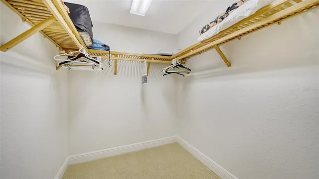 a view of a patio with couches table and chairs and potted plants