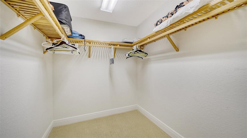 14041 Bellagio Way, Unit 316 Osprey, FL 34229 - Photo 35 of 74 a view of a room with rack on the wall