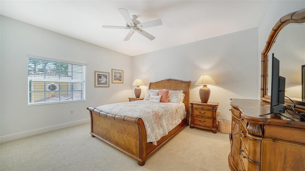 14041 Bellagio Way, Unit 316 Osprey, FL 34229 - Photo 36 of 74 a bedroom with bed and window