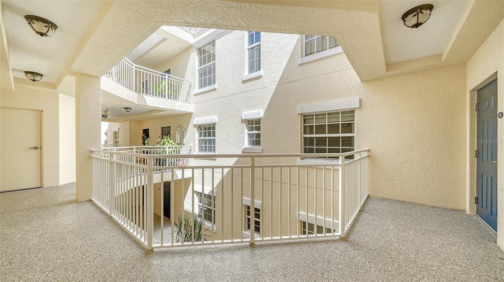 14041 Bellagio Way, Unit 316 Osprey, FL 34229 - Photo 4 of 74 a view of a house with a balcony