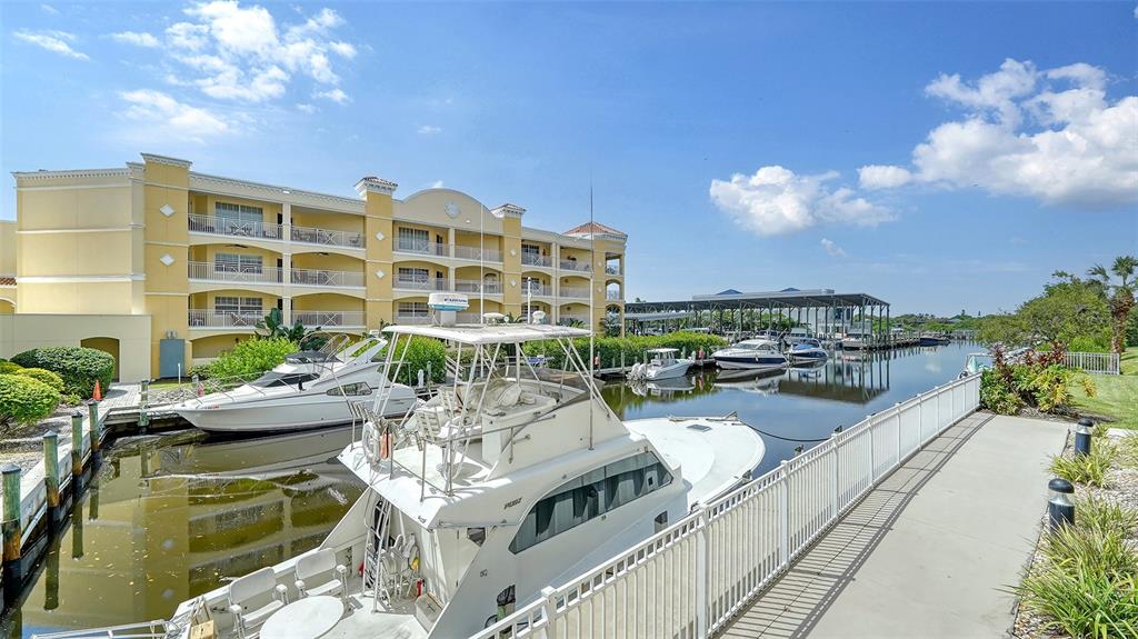 14041 Bellagio Way, Unit 316 Osprey, FL 34229 - Photo 44 of 74 a view of a swimming pool with outdoor seating
