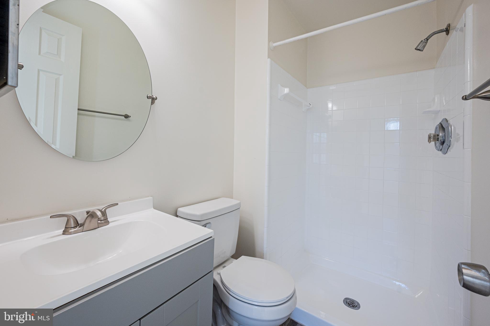 15967 Dorset Road Laurel, MD 20707 - Photo 21 of 27 Master bath with new vanity, floor and reglzed sh