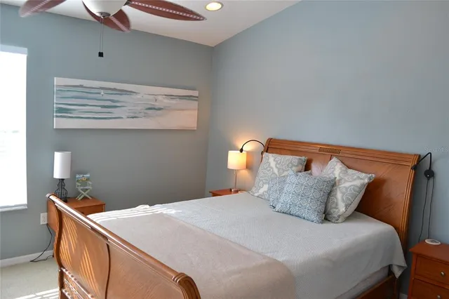 a spacious bedroom with a large bed and a balcony