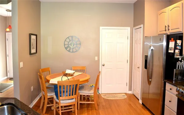 a view of a dining room with furniture and a chandelier