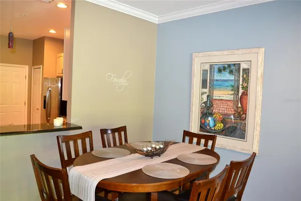 a view of a dining room with furniture and window