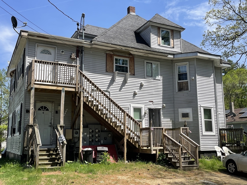 136 Brookside Road Orange, MA 01364 - Photo 3 of 10 a car parked in front of a house