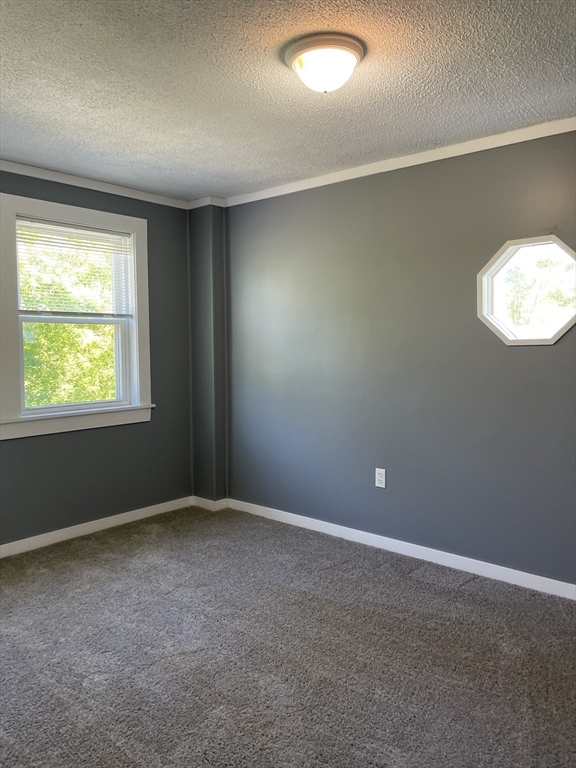 136 Brookside Road Orange, MA 01364 - Photo 7 of 10 an empty room with windows