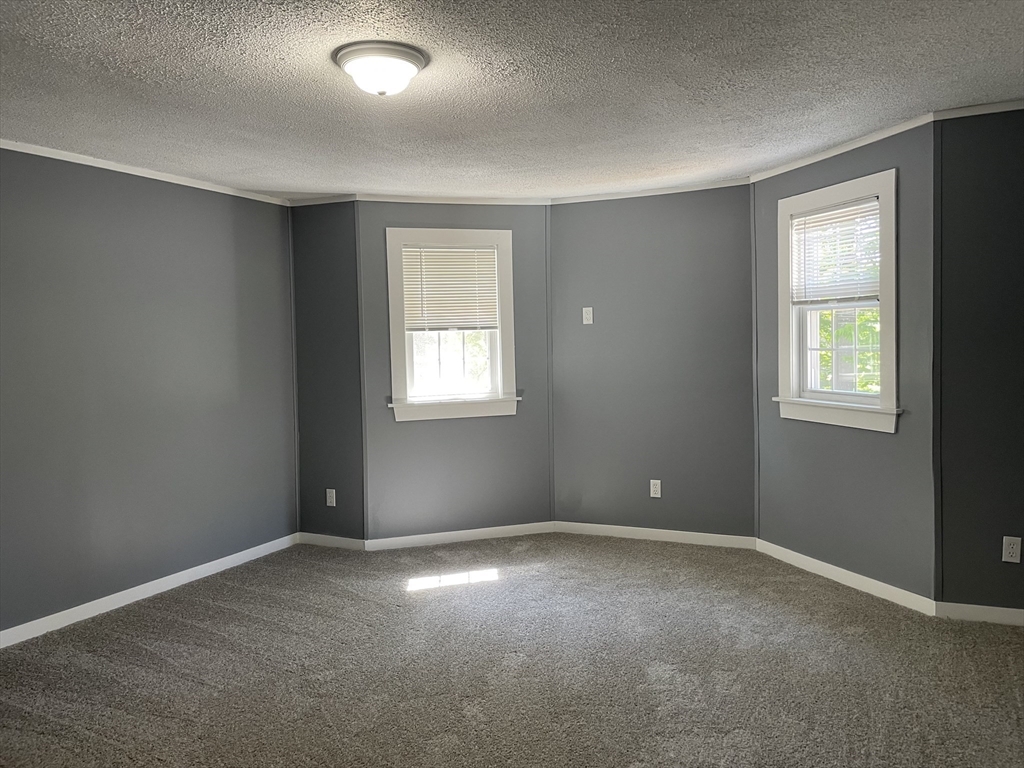136 Brookside Road Orange, MA 01364 - Photo 8 of 10 a view of an empty room with a window