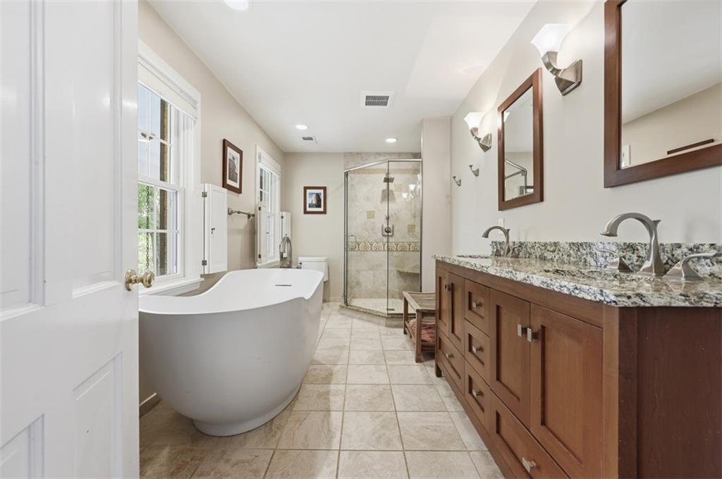 144 Springhouse Lane Pittsburgh, PA 15238 - Photo 22 of 49 Large bathroom with double sink vanity, soaking tub and walkin shower